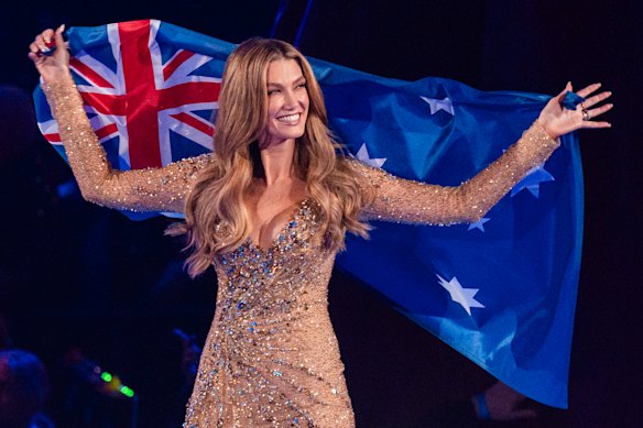 Australia’s Delta Goodrem draped in the Australian flag for the parade of nations at the Eurovision Grand Final.