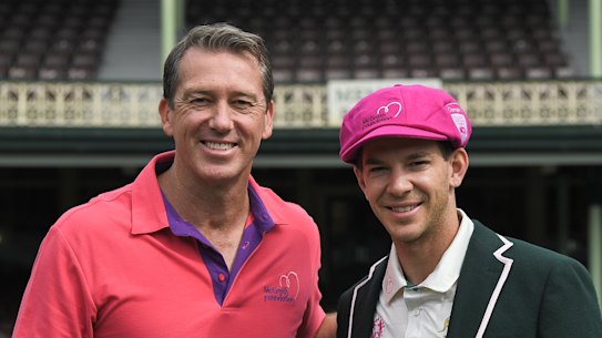 Former Australian cricketer Glenn McGrath poses for a photograph with Australia captain Tim Paine.