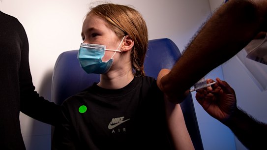 Twelve-year-old Eve, accompanied by her mum Narelle, having his first coronavirus vaccination in Melbourne last week.