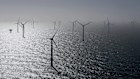 Numerous wind turbines, including some from RWE's new Kaskasi offshore wind farm, can be seen during the commissioning of the wind farm off Helgoland, Germany, Thursday March 23, 2023. (Christian Charisius/Pool via AP)