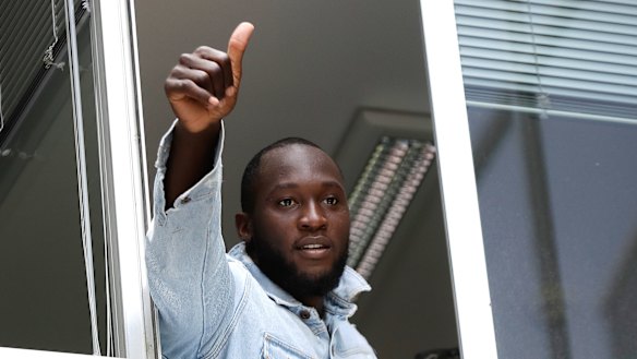 Ex-Red Devil Romelu Lukaku salutes Inter fans in Milan.