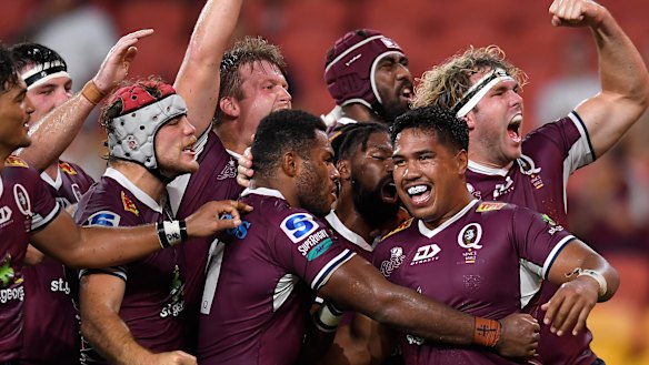 The Reds celebrate victory over the Rebels on their way to four straight wins and top spot on the Super Rugby AU ladder.