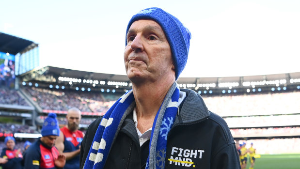 Neale Daniher walks through a guard of honour. 