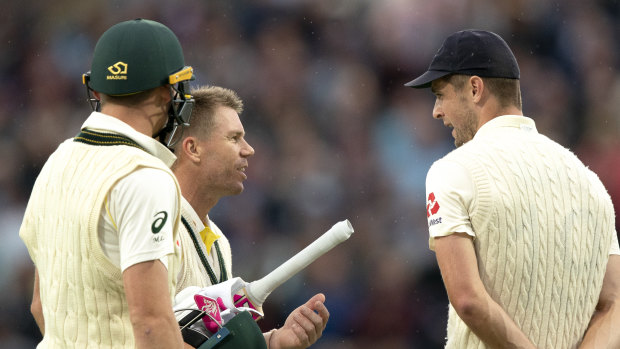 David Warner and Chris Woakes exchange words as the players came off for a delay.