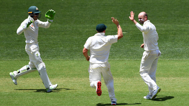 Over-spin, dip and bounce: Nathan Lyon reacts after dismissing Rohit Sharma.