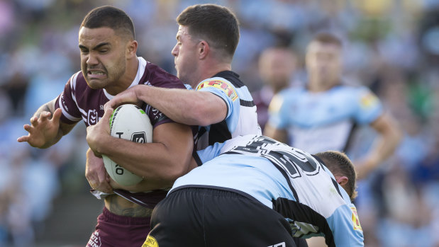 Making up for lost time: Walker back in action for Manly against the Sharks.