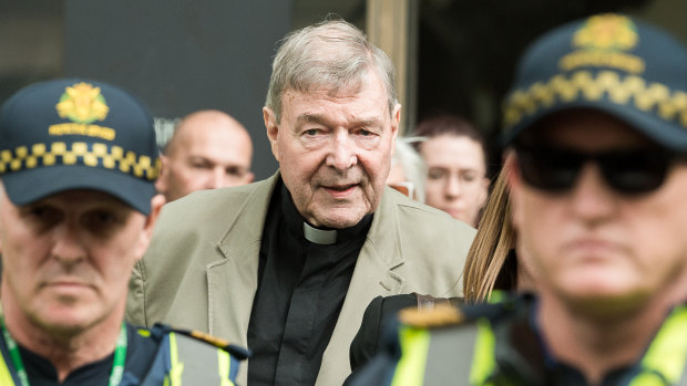 George Pell leaving court on Tuesday after a suppression order preventing publication of his crimes was lifted.