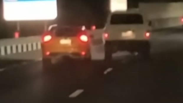 Footage of the road rage incident on the Logan Motorway shows a Toyota LandCruiser crossing dangerously into the lane where the Ford Focus was driving.