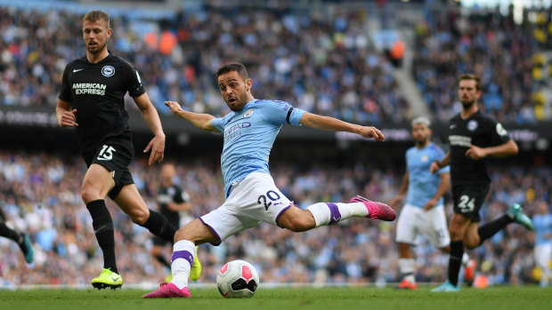 Walkover: Manchester City's Bernardo Silva scores his side's fourth goal at Etihad Stadium.