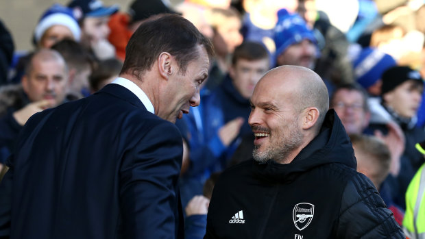 Everton caretaker manager, Duncan Ferguson, chats with interim manager of Arsenal, Freddie Ljungberg.