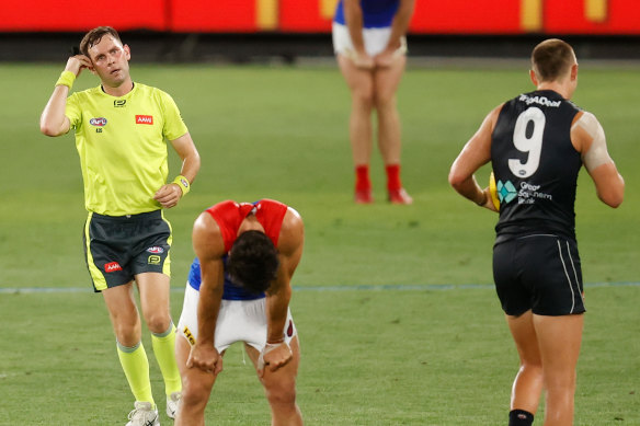 Christian Petracca reacts after a 50m penalty is paid against the Demons on Thursday night.