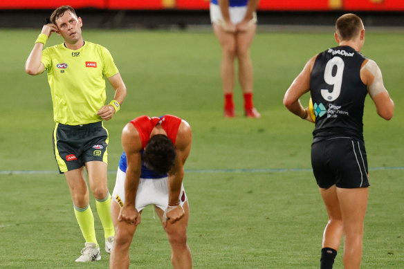 Christian Petracca reacts after a 50m penalty is paid against the Demons on Thursday night.