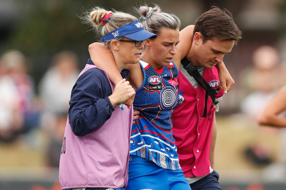 Deanna Berry leaves the field on Saturday.