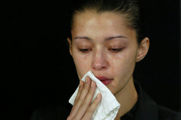 Michelle Leslie wipes tears from her face during a press conference in Sydney on November 25, 2005. 
