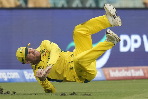 David Warner takes a spectacular catch to get Sri Lanka’s Kusal Mendis in Monday night’s World Cup match.