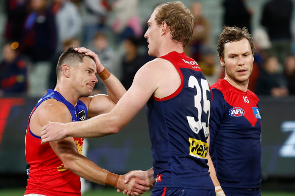 Dayne Zorko and Harrison Petty shake hands after Thursday’s game.