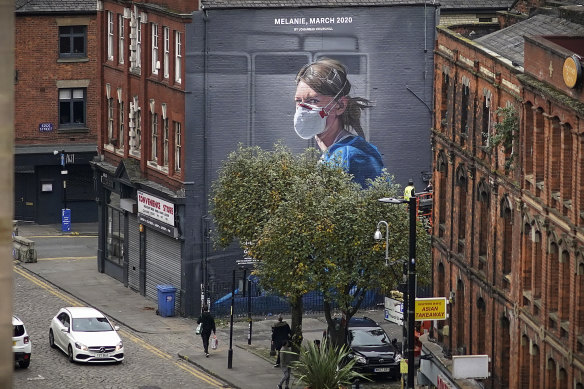 A mural depicting NHS nurse Melanie Senior in Manchester. The NHS is said to be close to collapse in the UK.