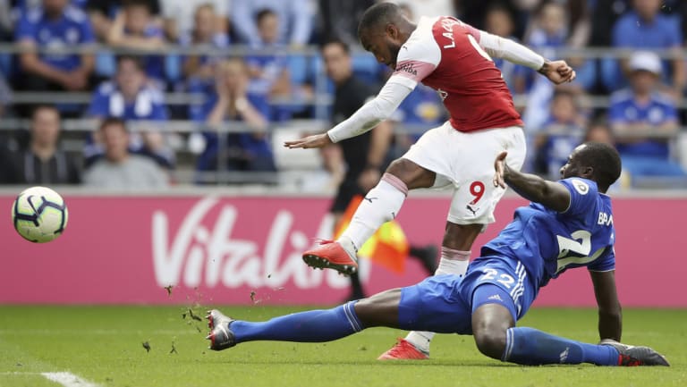 Arsenal's Alexandre Lacazette scores his side's winning goal against Cardiff City on Sunday.