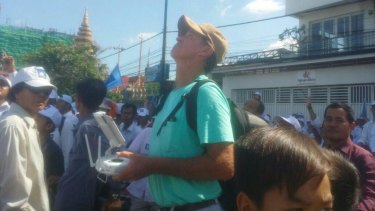 In this photo from Cambodian website Fresh News, Australian filmmaker James Ricketson is seen apparently operating a drone at a rally.