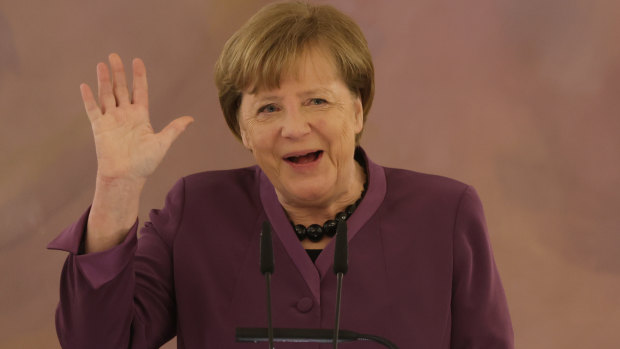 ‘Ambition, wisdom and passion’: Merkel awarded Germany’s highest honour