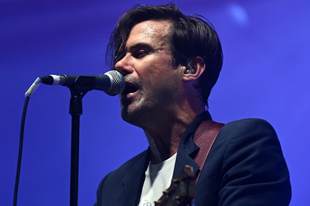 Phil Jamieson, frontman of rock band Grinspoon, performs during the One From The Heart benefit concert on May 15, 2022 in Lismore, Australia. The concert was put on to lift the spirits of Lismore residents who are still dealing with the aftermath of multiple flood events which hit the town earlier this year.