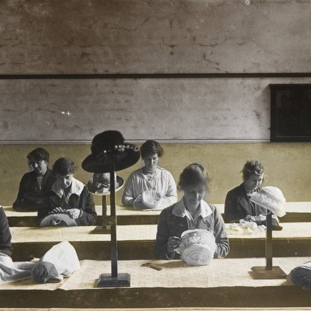 A millinery class for wives of men killed in action, 1919.