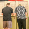 Voters at a polling booth at Fitzroy North Primary School.