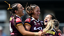 Broncos players celebrate defeating the Warriors in the final round of the regular season.