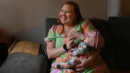 Sarah Oliver gives her four month old daughter Matilda Oliver-Nalder a bottle of breast milk at home in Roselands.