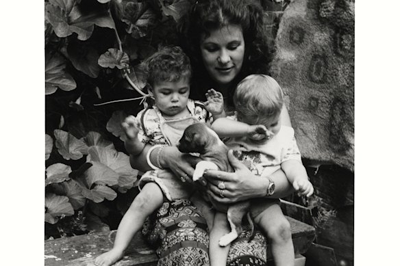 Penny with her twins Brooke and Trinity and puppy Pirate, Capel Street, West Melbourne, c. 1980