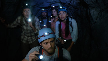 Trying to survive a killer croc in the darkness in Black Water: Abyss.