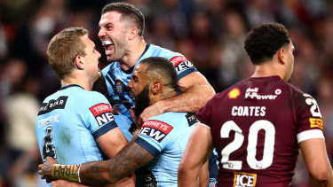 James Tedesco celebrates with his Blues teammates at Suncorp Stadium during game two.