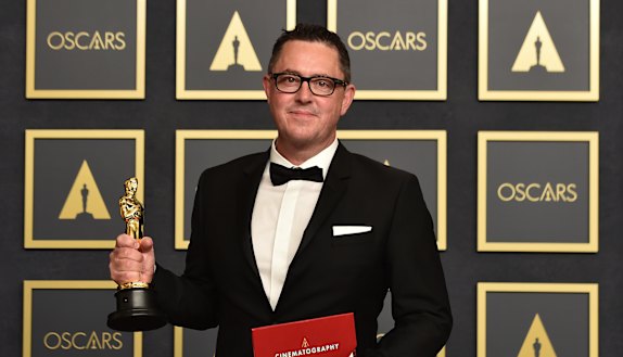 Greig Fraser in the press room with his Oscar for best cinematography for Dune.