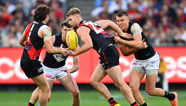 Essendon’s players have been given a lesson on the club’s fierce rivalry with Carlton.