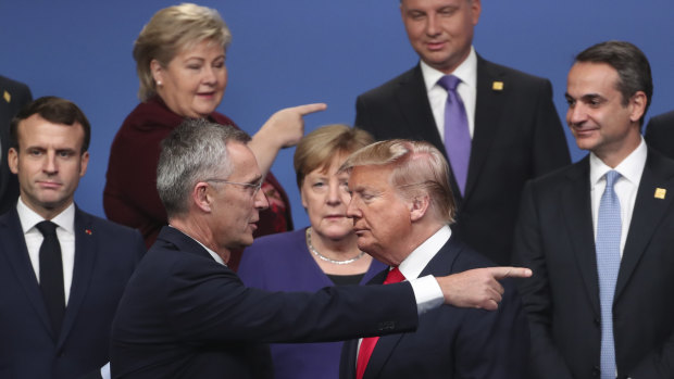 NATO Secretary-General Jens Stoltenberg speaks with US President Donald Trump at a NATO leaders' meeting in Watford, England in December.