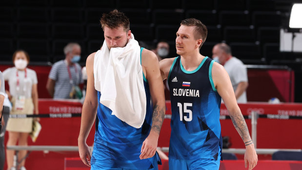 Luka Doncic #77 of Team Slovenia and teammate Gregor Hrovat #15 of walk off the court in disappointment following their loss to Team France.