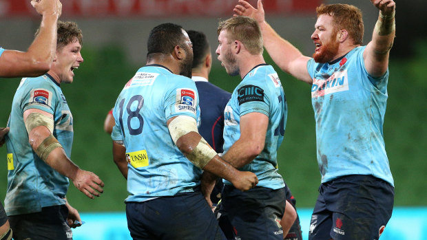 Alive and kicking: the Waratahs celebrate their victory.