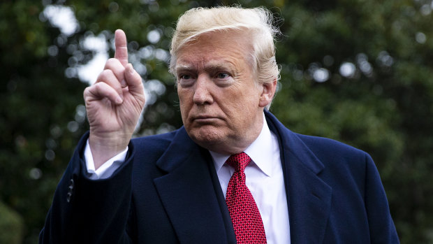 Big talker: Trump talks to journalists on the South Lawn of the White House on January 14. 
