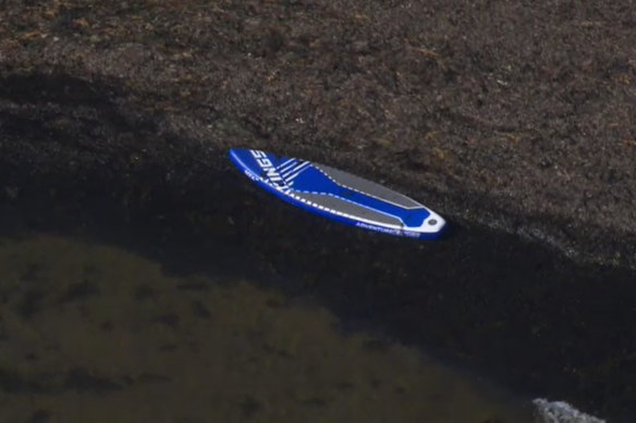 A paddleboard in the waters of Port Phillip Bay, where four teenagers were rescued.