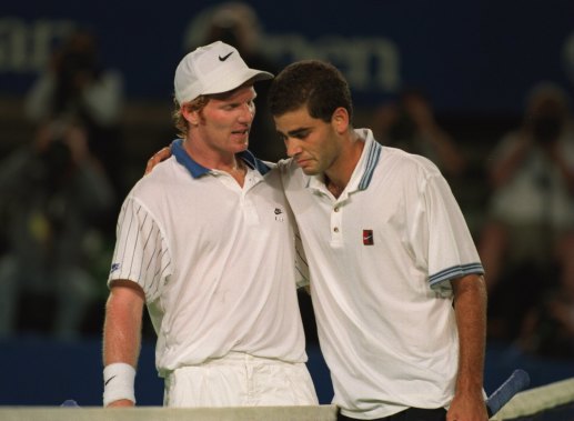 Sampras is comforted by his opponent Jim Courier after he broke down in tears during their quarter-final.