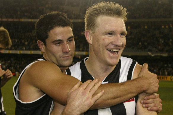 Paul Licuria and Nathan Buckley after a win in 2002.