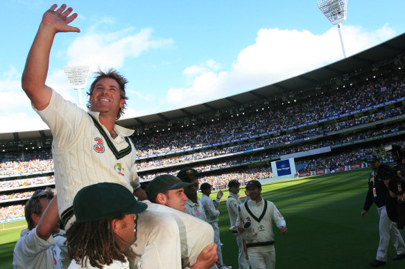 Shane Warne is chaired off after his final game at the MCG. The Great Southern Stand will be renamed after him.