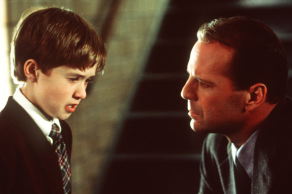 Bruce Willis in one of his most famous roles, with Haley Joel Osment in The Sixth Sense.