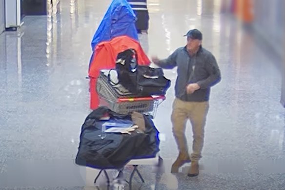 CCTV footage shows an unknown man collecting shoes at Kenmore Village Shopping Centre.