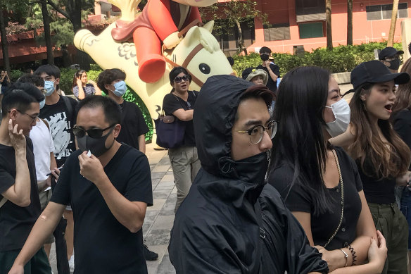 Protesters gather outside Sha Tin court on Thursday as the case of the schoolboy shot by police is heard.