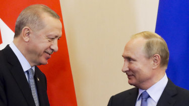 Turkish President Recep Tayyip Erdogan, left, and Russian President Vladimir Putin look at each other during a joint press conference with  following their talks in Russia.