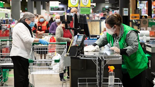 Retail workers, who kept the country fed during the height of panic buying and interact with customers all day, are one group unions and business wants to have early vaccine access.