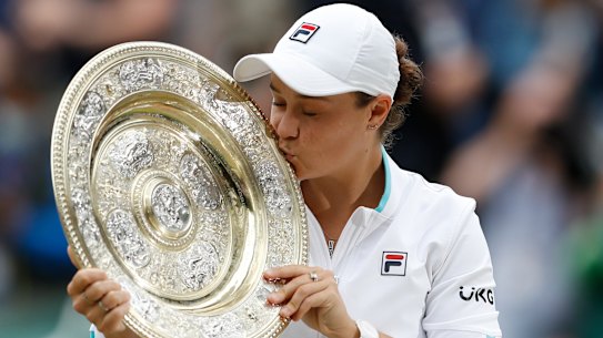 Ash Barty kisses the Wimbledon trophy after ending the 41-year drought for Australian women at the tournament in 2021.