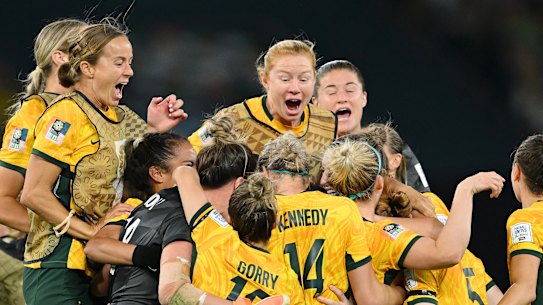 A night for the ages: The Matildas come together after the winning penalty.