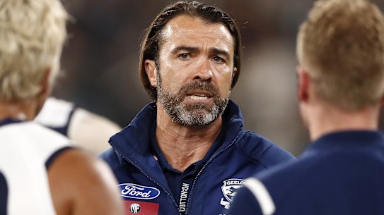 Geelong coach Chris Scott addresses his players during the MCG blockbuster against the Tigers.